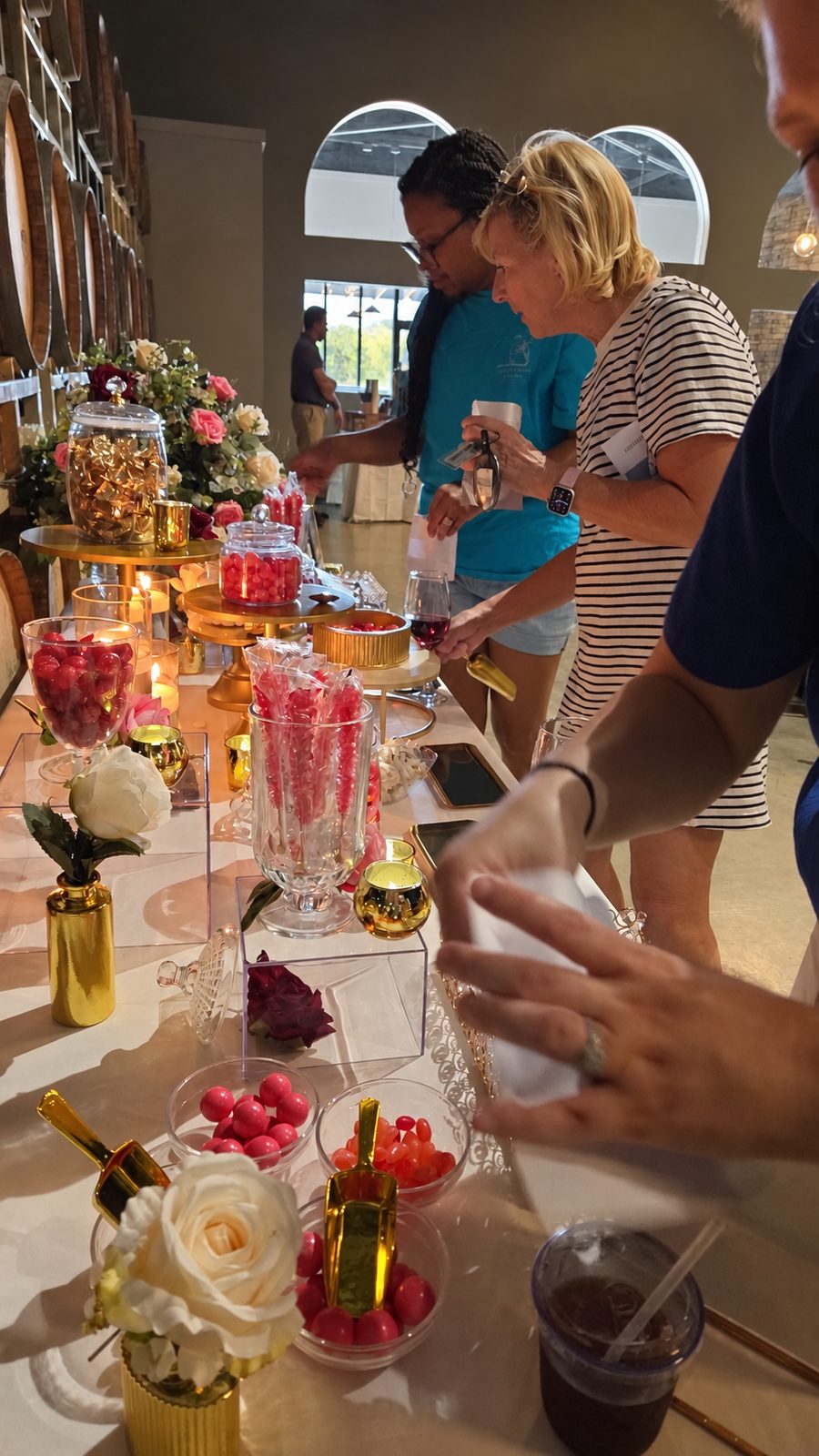 Guests scooping candy at the candy bar display