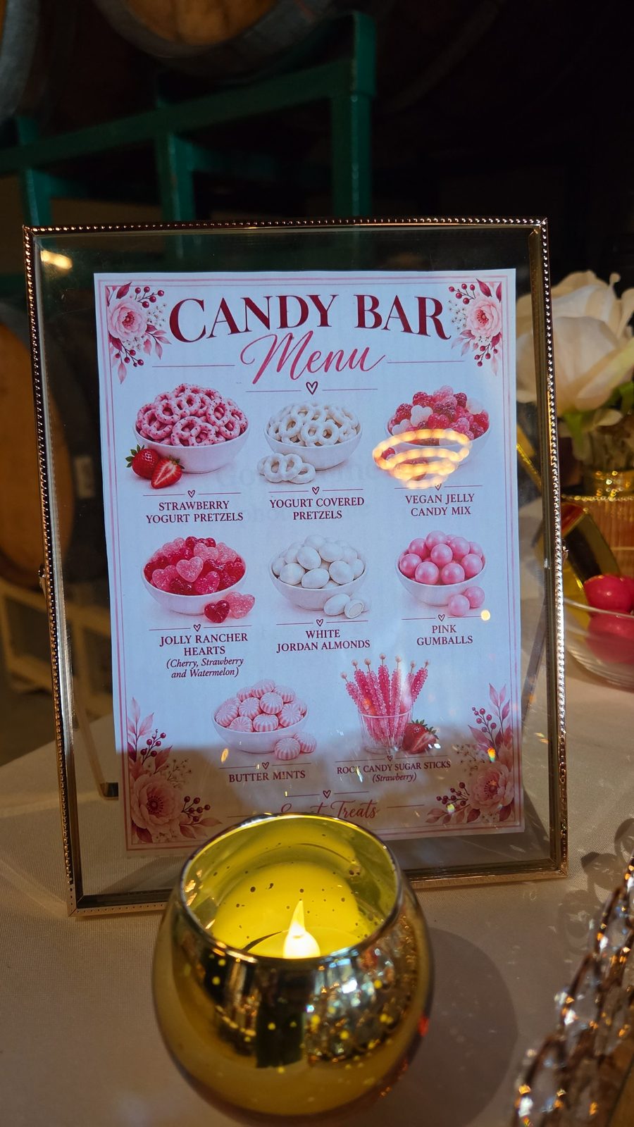 Framed candy bar menu sign with candlelight