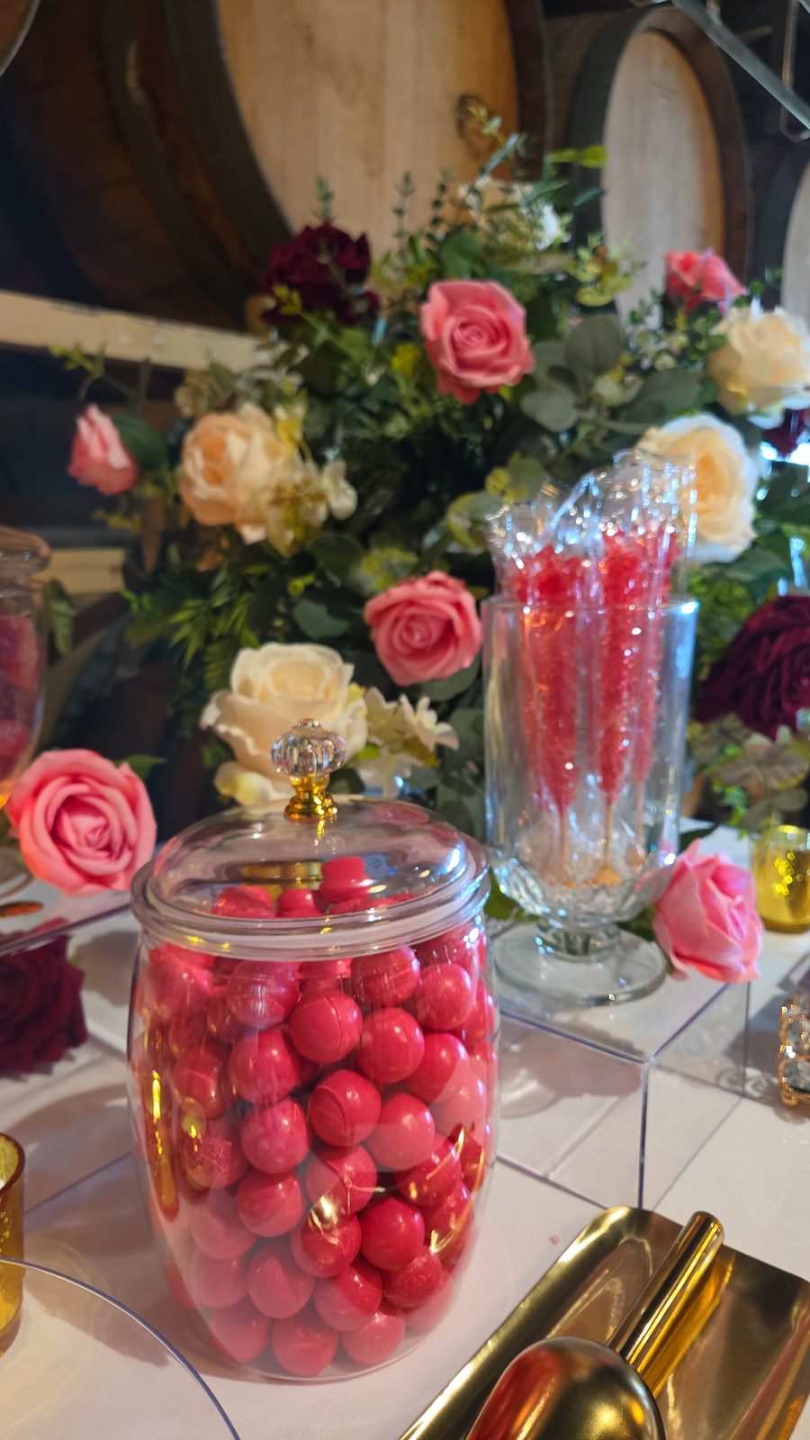 Pink gumballs and rock candy sticks styled with roses