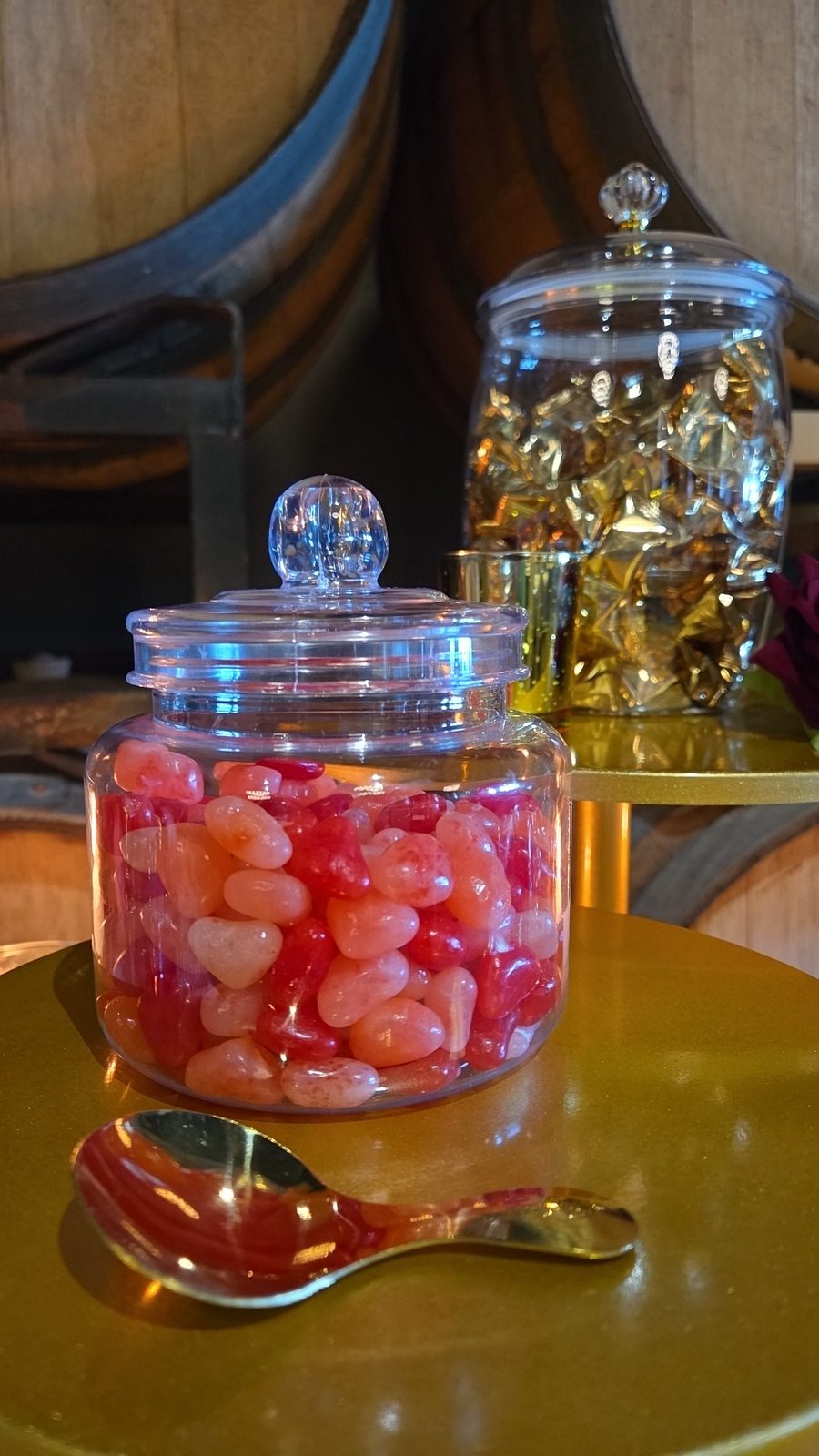 Red jelly bean jar with a gold spoon