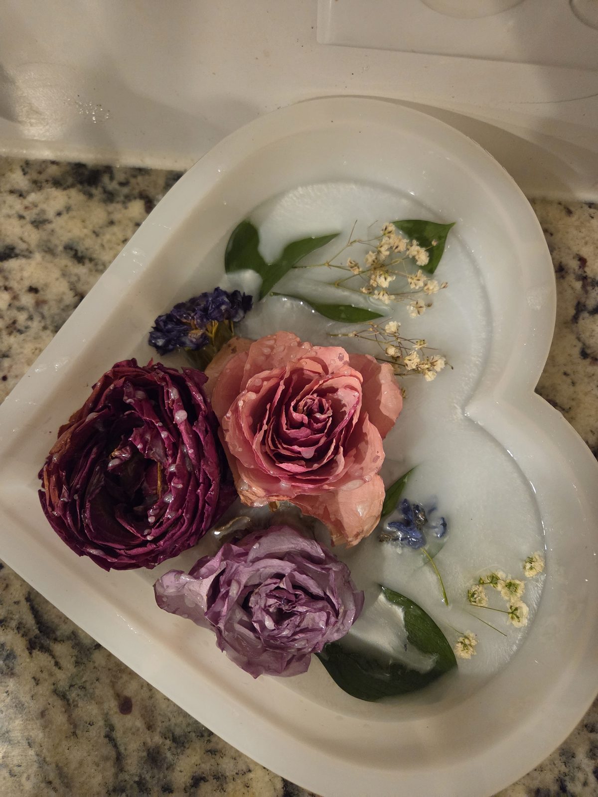 Fresh flowers being preserved in resin